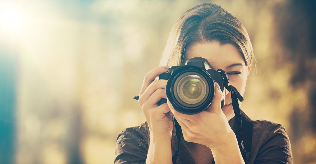 Photo of a Man Holding a Camera · Free Stock Photo